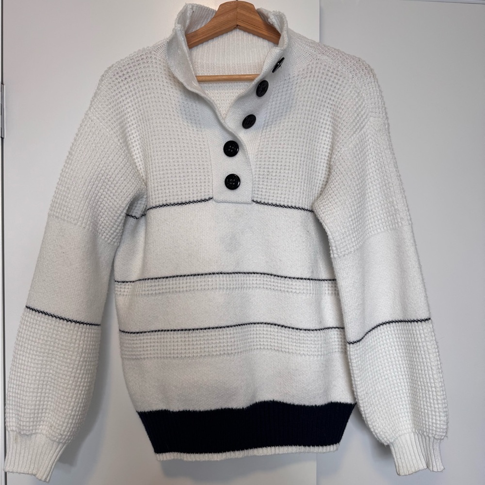White knit sweater with black details
